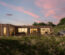 distant shot of pique's hillside harmorny 4 bedroom modular home during sunset