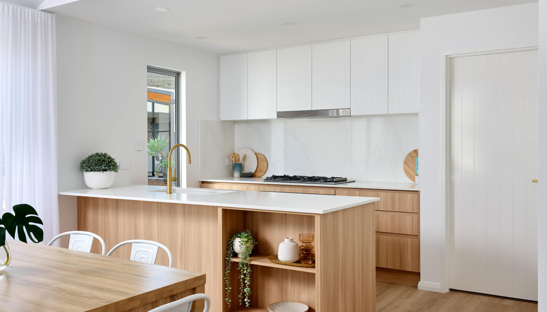 Kitchen area inside the 4 bedroom modular home Shorehouse design by PIQUE